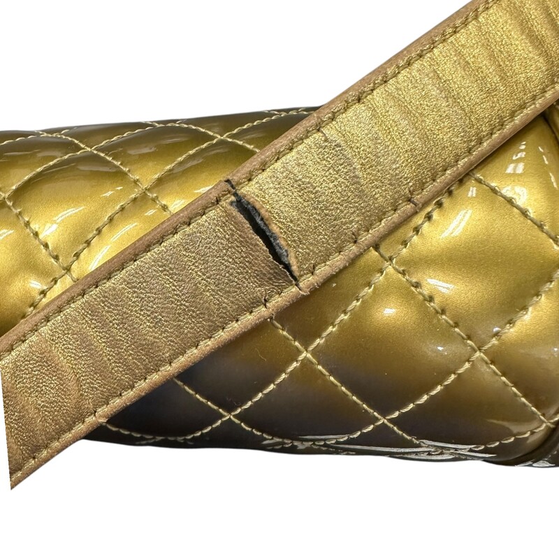 Chanel Boy Patent Gold Medium Handbag<br />
<br />
Date Code: 1973****<br />
<br />
Dimensions:<br />
Length: 9.75 in<br />
Width: 3 in<br />
Height: 5.5 in<br />
Drop: 21 in<br />
Drop: 12 in<br />
<br />
In very good condition. Light scuffsing to the hardware and corners of handbag. Crack on the inside of the strap and leather torn. Strap is still in working condition.<br />
<br />
Does not come with the original dust bag or box.