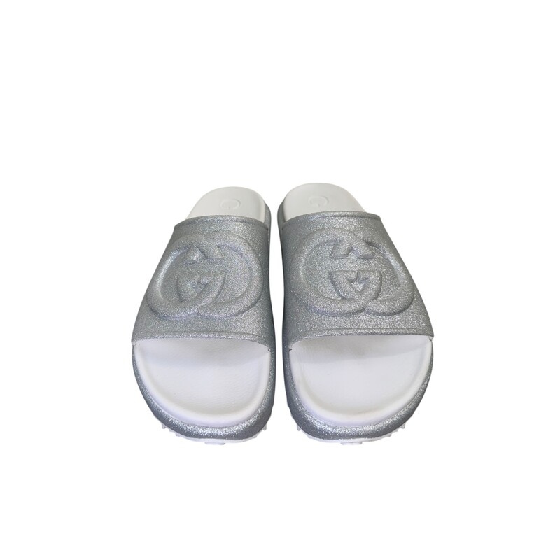 Gucci Miami Glitter Silver Slides<br />
<br />
Size: 41<br />
<br />
Code: 725541<br />
<br />
In very good condition. Light wear to the shoes.<br />
<br />
Comes with the original box.