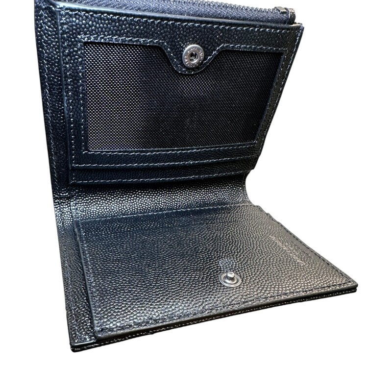Saint Laurent Cassandre Grained Leather Compact<br />
<br />
Serial Code:BND57879.0822<br />
<br />
Dimensions: 4.5 L x 3.5 H inches<br />
<br />
In excellent condition. Like new<br />
<br />
Comes with the orginal dust bag and box.