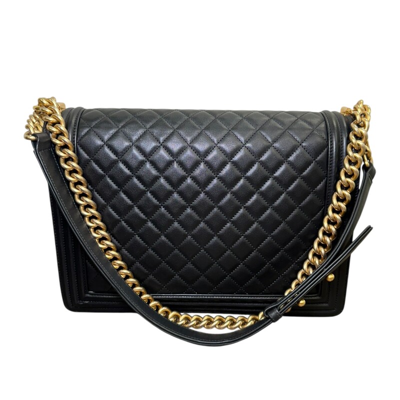 Chanel Black Boy Quilted Chain Large Bag<br />
<br />
Serial Code:20516849<br />
<br />
Dimensions: 12 L x 9 H inches<br />
<br />
In excellent condition.Some faint marks on the hardware. Very minor corner wear.<br />
<br />
Comes with the original dust bag and box.