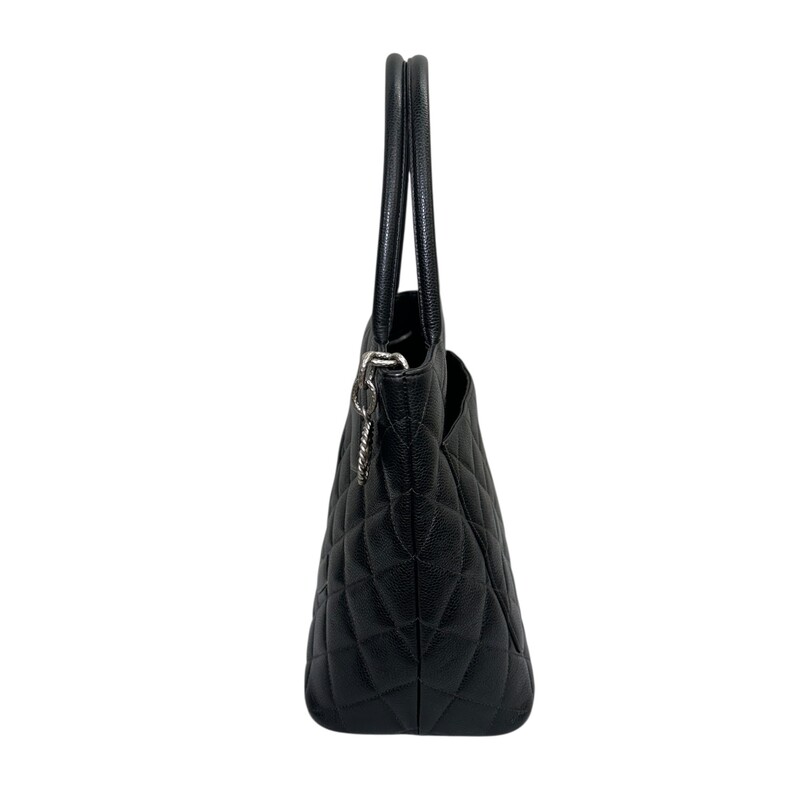Chanel Medallion Black Tote<br />
<br />
Serial Code:68*****<br />
<br />
Dimensions: 11 L X 10 H inches<br />
<br />
In very good condition. Some minor marks inside the interior.<br />
<br />
Does not come with the original dust bag or box.