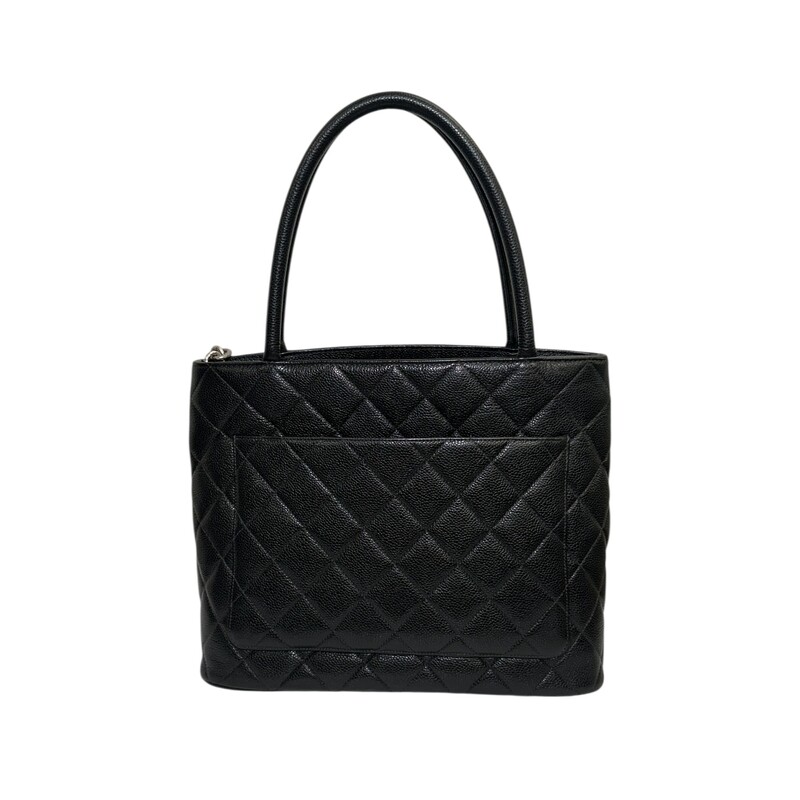 Chanel Medallion Black Tote<br />
<br />
Serial Code:68*****<br />
<br />
Dimensions: 11 L X 10 H inches<br />
<br />
In very good condition. Some minor marks inside the interior.<br />
<br />
Does not come with the original dust bag or box.