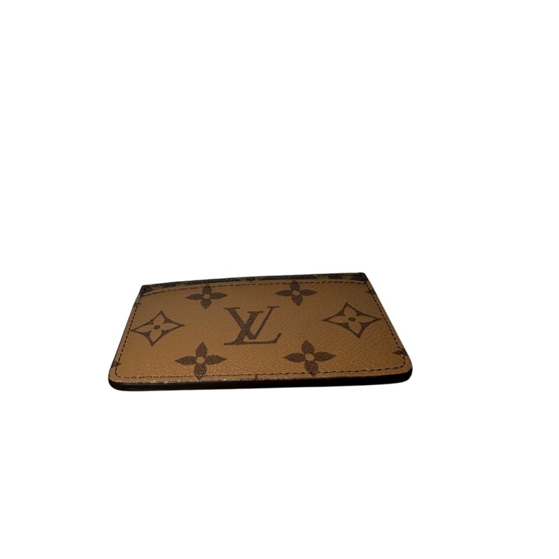 Louis Vuitton Reverse Card Holder<br />
<br />
Date Code: Microchip<br />
<br />
Dimensions: 4 L x 2.5 H inches<br />
<br />
In excellent condition. Like new<br />
<br />
Comes with the orginal dust bag and box.