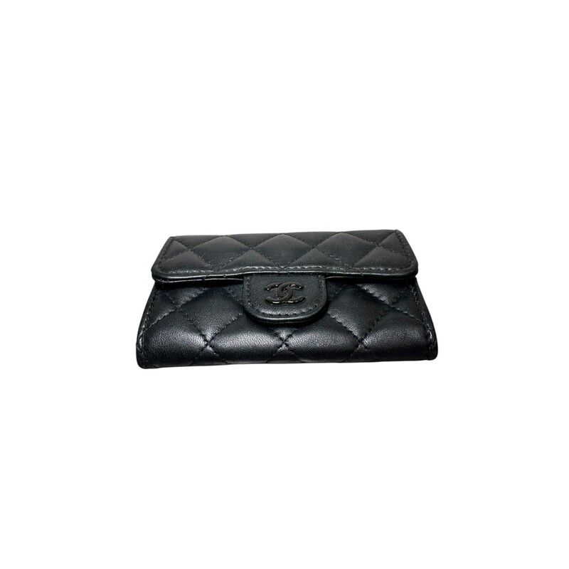 Chanel So Black Classic  Lambskin Flap Card<br />
<br />
Serial Code: GH4****<br />
<br />
In very good condition. Some minor scratches on the in the interior leather .<br />
<br />
Dimensions: 4.5 L X 3 H inches<br />
<br />
Does not come with the original dust bag or box.