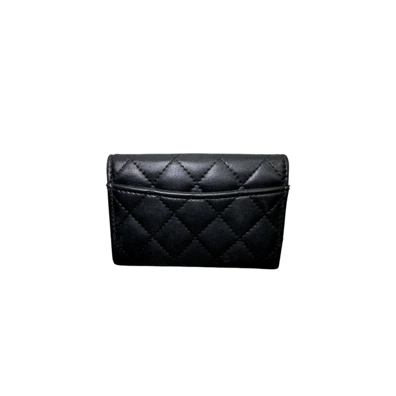 Chanel So Black Classic  Lambskin Flap Card<br />
<br />
Serial Code: GH4****<br />
<br />
In very good condition. Some minor scratches on the in the interior leather .<br />
<br />
Dimensions: 4.5 L X 3 H inches<br />
<br />
Does not come with the original dust bag or box.
