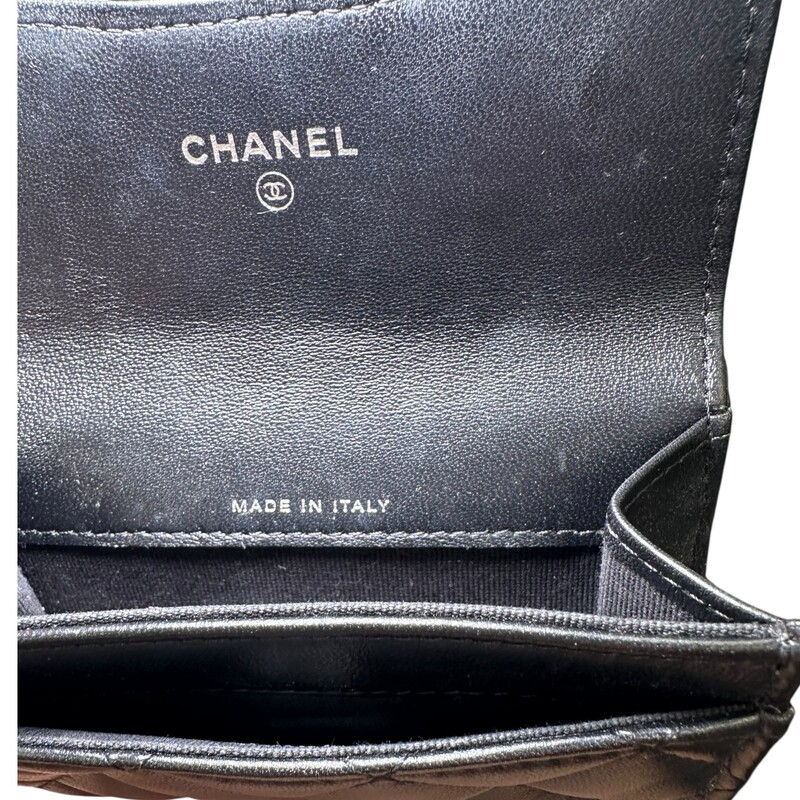 Chanel So Black Classic  Lambskin Flap Card<br />
<br />
Serial Code: GH4****<br />
<br />
In very good condition. Some minor scratches on the in the interior leather .<br />
<br />
Dimensions: 4.5 L X 3 H inches<br />
<br />
Does not come with the original dust bag or box.
