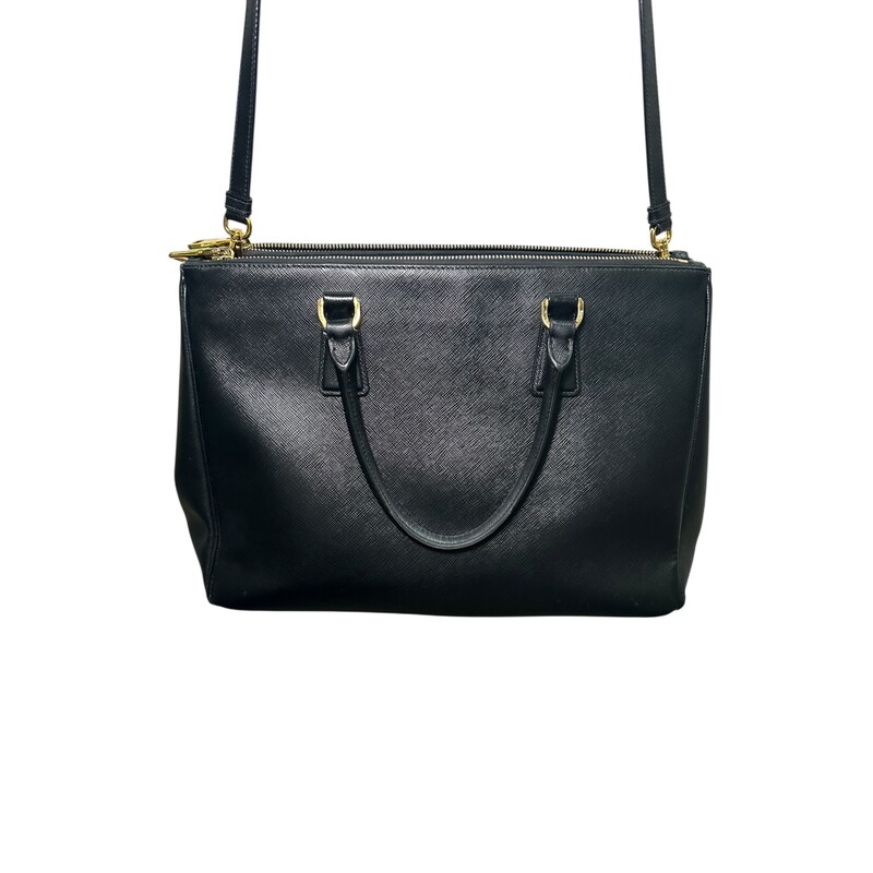 Prada Galleria Double Black Tote with Strap<br />
<br />
<br />
Dimensions:Handle Drop: 5<br />
Height: 10.5<br />
Width: 14.5<br />
Depth: 6<br />
<br />
In very good condition. Light tariching to the hardware. And wear to corners.<br />
<br />
Comes with original dust cover. No box.