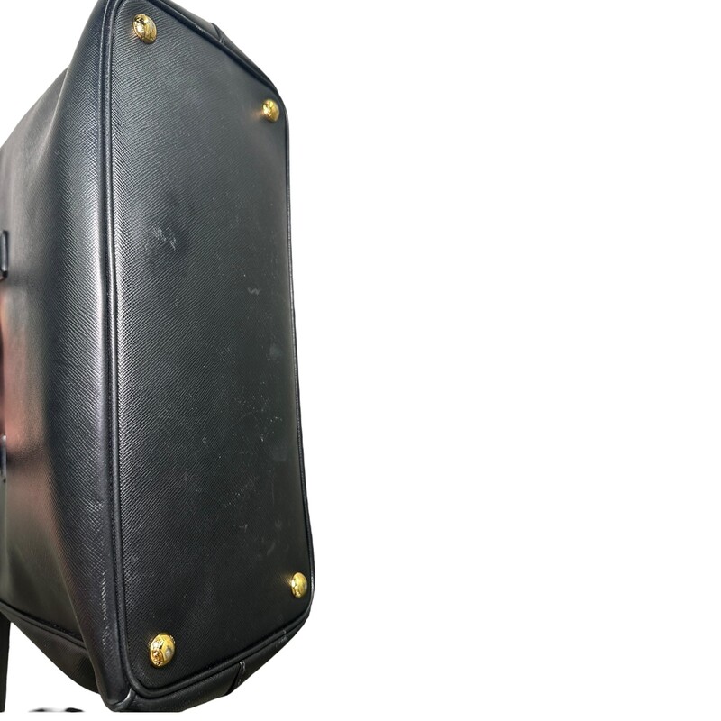 Prada Galleria Double Black Tote with Strap<br />
<br />
<br />
Dimensions:Handle Drop: 5<br />
Height: 10.5<br />
Width: 14.5<br />
Depth: 6<br />
<br />
In very good condition. Light tariching to the hardware. And wear to corners.<br />
<br />
Comes with original dust cover. No box.