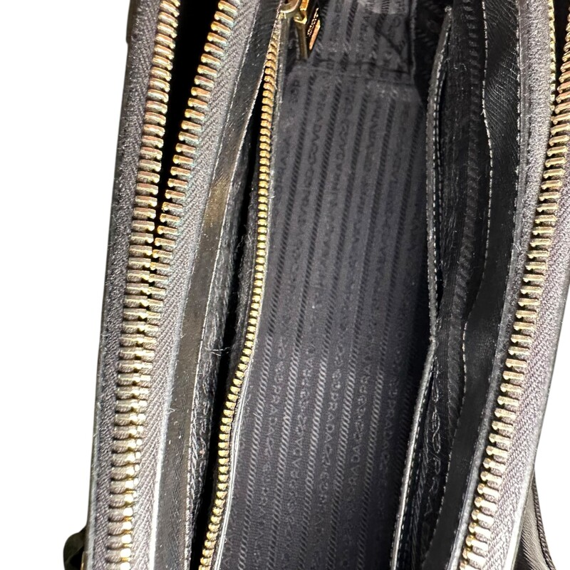 Prada Galleria Double Black Tote with Strap<br />
<br />
<br />
Dimensions:Handle Drop: 5<br />
Height: 10.5<br />
Width: 14.5<br />
Depth: 6<br />
<br />
In very good condition. Light tariching to the hardware. And wear to corners.<br />
<br />
Comes with original dust cover. No box.