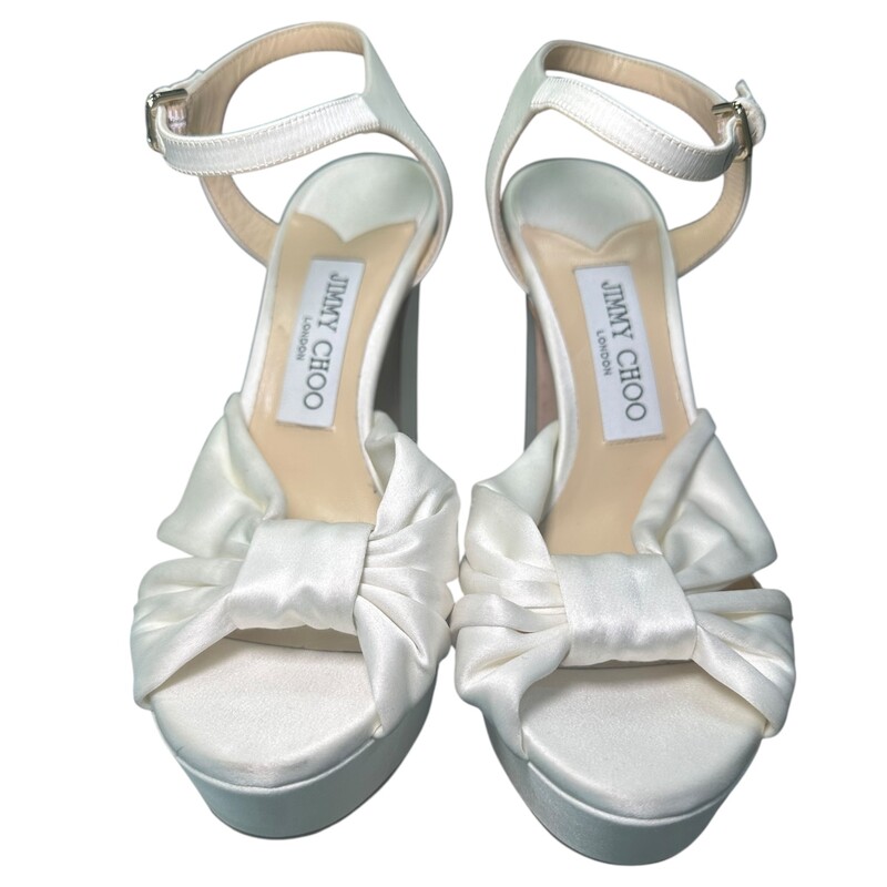 Jimmy Choo Heloise 120 White<br />
<br />
Size: 37<br />
<br />
In good condition. Light wear throughout the satin.<br />
<br />
Does not come with the original dust bag or box.