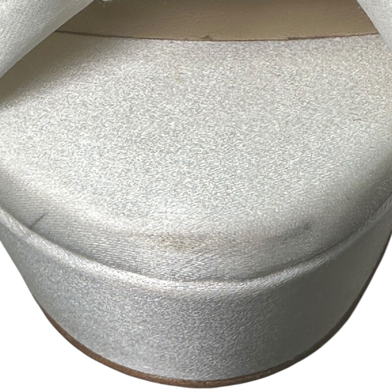 Jimmy Choo Heloise 120 White<br />
<br />
Size: 37<br />
<br />
In good condition. Light wear throughout the satin.<br />
<br />
Does not come with the original dust bag or box.
