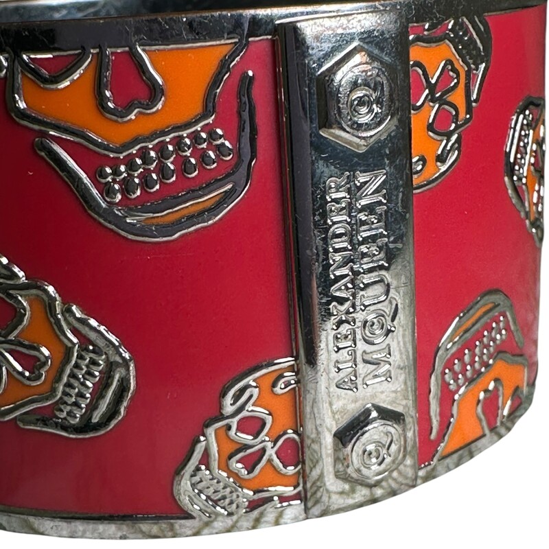 Alexander Mcqueen Skull Enamel Orange & Red Cuff<br />
<br />
In very good condition. Some scratching throughout.<br />
<br />
Does not come with the original dust bag or box.