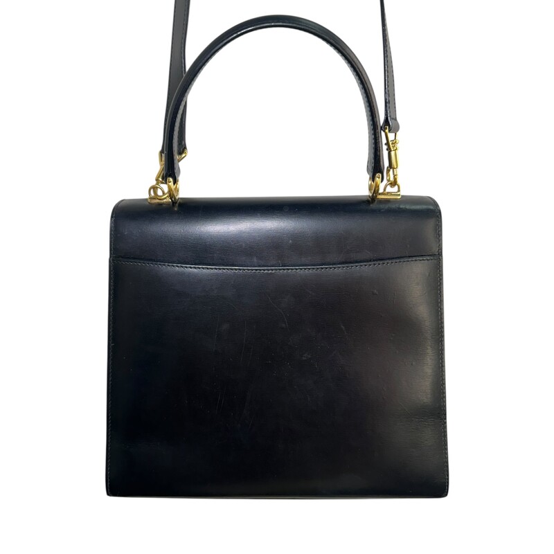 Gucci Lady Lock Top Handle Black Handbag<br />
<br />
Code:<br />
260258<br />
<br />
Dimensions:<br />
9.4in W x 7.9in x 3.5inD<br />
<br />
In very good vintage condition. Light marks in the interior and throughout the bag.<br />
<br />
Does not come with the original dust bag or box.