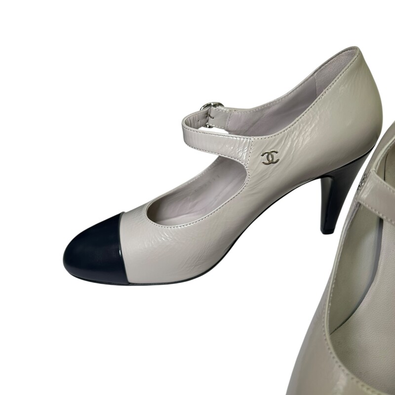 Chanel Maryjane  Captoe Leather Two Tone<br />
<br />
Gray & Black Leather Heels<br />
<br />
37.5<br />
<br />
Style Code:  G39111<br />
<br />
In excellent condition. Like new .<br />
<br />
Comes with the orginal dust bag and box.