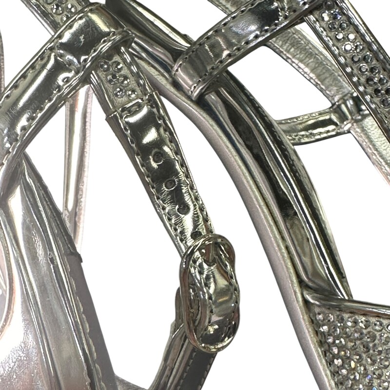 Dolce & Gabbana Silver Rhinestone Slingback Heels<br />
<br />
Size: 37<br />
<br />
Good Condition<br />
<br />
Light wear to the bottom of the shoes and light discoloration to the right shoe<br />
<br />
Does not come with dust bag or box.
