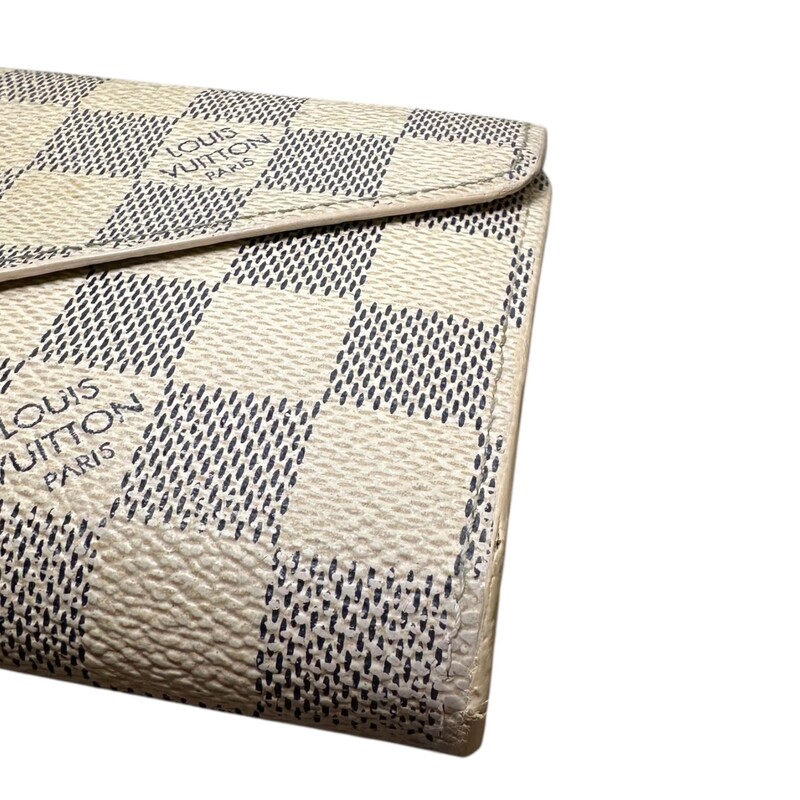 Louis Vuitton Josephine Azur Wallet with Pouch

Date Code:TN4182

Dimensions: 7 L x 4 H inches

In good condition. Some marks through out the canvas. Pen mark on the interior and slight warping of the interior canvas.

Comes with the original dust bag and box.