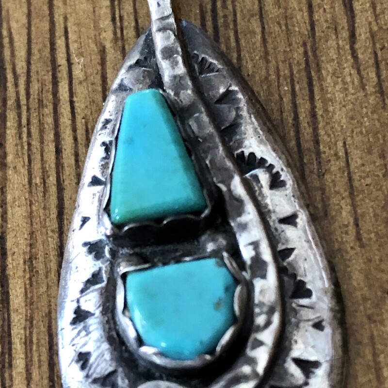 Vintage Zuni sterling & turquoise snake motif pendant handcrafted by master zuni artist Effie Calavaza.
Crafted from sterling silver and sleeping beauty turquoise with a total of 4 turquoise stones, 2 inlayed to create the snake's eyes and 2 bezel set. It also has imprinted designs.

The Zuni believe the snake symbolizes rebirth and renewal. 7/8in wide X 1 3/4in high including the bale.