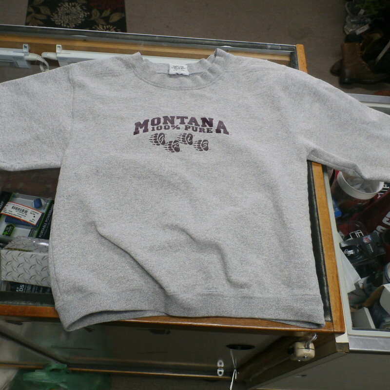 Montana Grizzlies NCAA YOUTH sweatshirt gray size M(10-12) cotton blend #16713
Rating: (see below)- 3 - Good Condition
Team: Montana Grizzlies - NCAA
Players: Team 
Brand: The Cotton Exchange
Size: Medium (10-12) YOUTH (Measured Flat: chest 16.5\"; Length 21\")
armpit to armpit & top of shoulder to bottom hem
Color: Gray
Material: 80 cotton 20 polyester
Style: crew neck sweatshirt; heavy; screen pressed front logo; embroidered sleeve logo
Condition: - Good condition: wrinkled; pilling and fuzz are present; noticeable staining on the sleeves and on the front above the logo near the neck; fabric feels course; material is faded and discolored from washing and use;
Item # 16713 
Shipping: $4.62