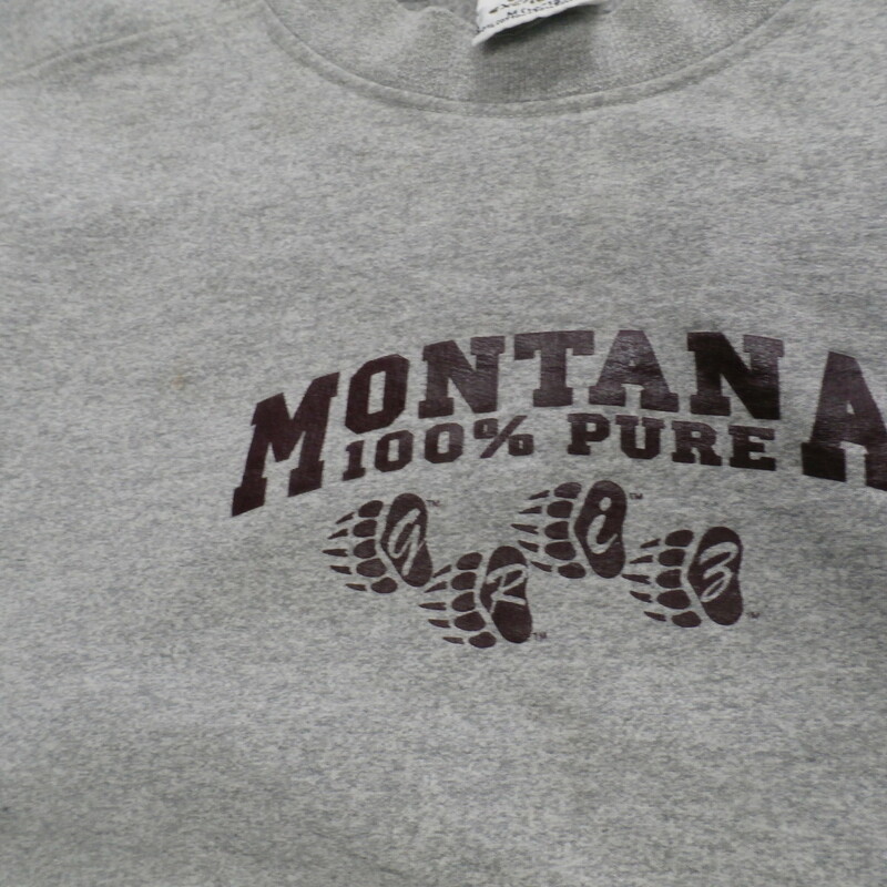 Montana Grizzlies NCAA YOUTH sweatshirt gray size M(10-12) cotton blend #16713
Rating: (see below)- 3 - Good Condition
Team: Montana Grizzlies - NCAA
Players: Team 
Brand: The Cotton Exchange
Size: Medium (10-12) YOUTH (Measured Flat: chest 16.5\"; Length 21\")
armpit to armpit & top of shoulder to bottom hem
Color: Gray
Material: 80 cotton 20 polyester
Style: crew neck sweatshirt; heavy; screen pressed front logo; embroidered sleeve logo
Condition: - Good condition: wrinkled; pilling and fuzz are present; noticeable staining on the sleeves and on the front above the logo near the neck; fabric feels course; material is faded and discolored from washing and use;
Item # 16713 
Shipping: $4.62