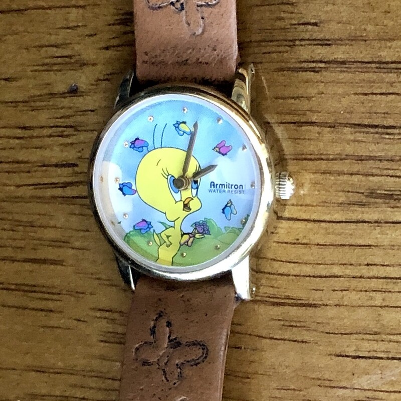 Armitron Warner Bros. 1997 Tweety Bird Watch. Has a cool dimentional look with Tweety in the background and second hand features moving butterflies. Original leather band with embossed butterflies. Will need a battery.