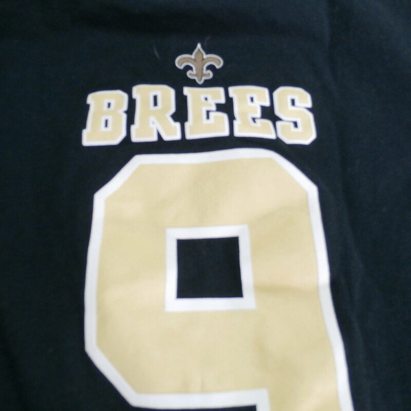 New Orleans Saints #9 Drew Brees YOUTH shirt size Medium 5/6 black cotton #19212<br />
Rating:   (see below) 3- Good Condition<br />
Team: New Orleans Saints<br />
Player: Drew Brees #9<br />
Brand: NFL<br />
Size :  Medium 5/6 - YOUTH ( Chest: 13\" x Length: 17\" ) measured armpit to armpit and shoulder to hem<br />
Color: Black<br />
Style: Crew neck shirt; short sleeve; screen pressed<br />
Material :  100% Cotton;<br />
Condition: 3 -Good Condition -  noticeable pilling and fuzz; wrinkled; fabric is slightly faded and discolored from washing and use;<br />
Item #: 19212<br />
Shipping: FREE