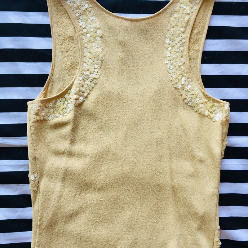 Valentino sleeveless tank with cutouts. This item has a very unique and fun design with detailed sequin work. Size small; Tan