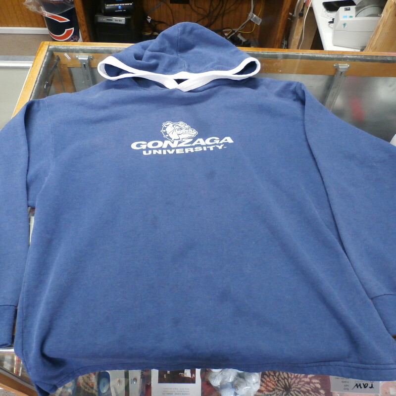 Gonzaga Bulldogs YOUTH hoodie blue size Large 14-16 poly cotton blend #22143<br />
Rating: (see below) 4- Fair Condition<br />
Team: Gonzaga Bulldogs<br />
Player:  team<br />
Brand: Kid N' Me<br />
Size : Youth- Large 14-16 ( Measures Chest 18\" ; Length 21.5\") armpit to armpit; shoulder to hem<br />
Color: blue<br />
Style: long sleeve; screen printed<br />
Material: 150% cotton 50% polyester<br />
Condition: 4- Fair Condition; wrinkled; some pilling and fuzz; material is stretched and worn from wearing and washing; some fading and discoloration; large 3-inch stain next to logo; several smaller stains on front; logo is cracked (see photos)<br />
Item #: 22143<br />
Shipping: FREE