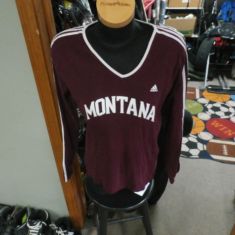 Women's Adidas Montana Grizzlies long sleeve maroon 100% cotton size L #22512
Rating: (see below) 3- Good Condition
Team: Montana Grizzlies
Player: Team
Brand: Adidas
Size: Women's Large (Chest: 20\" x Length: 24\";) measured flat - armpit to armpit and shoulder to hem
Color: maroon with white accents
Style:  long sleeve; screen printed; v-neck
Material: 100% cotton
Condition: 3-Good Condition;  wrinkled; some pilling and fuzz; material is worn from wearing and washing; some fading and discoloration; no rips or tears; no stains; screen printing is cracked and worn (see photos)
Item #: 22512
Shipping: FREE