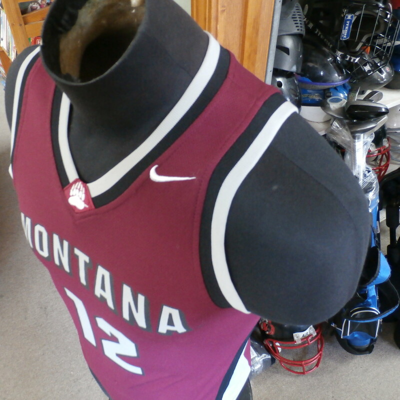 Montana Grizzlies Nike men's tank top Maroon size small #22839<br />
Rating: (see below) 3- Good Condition<br />
Team: Montana Grizzlies<br />
Player: n/a<br />
Brand: Nike<br />
Size: Small- men's (Measured Flat: chest 17\", length 24\")<br />
Color: Maroon<br />
Style: sleeveless; screen printed<br />
Material: 100% polyester<br />
Condition: 3- Good Condition - some pilling and fuzz; some fading and discoloration; wrinkles; some stretching and wear from washing and wearing; screen printing is worn and faded; small rip in the \"O\" on the front; 3 dark streaks on \"2\" on the back (see photos)<br />
Item #: 22839<br />
Shipping: FREE