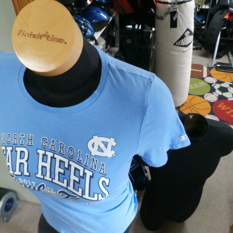 North Carolina Tar Heels Final Four 2017 shirt Champion blue size medium  #22830
Rating: (see below) 2- Great Condition
Team: North Carolina Tar Heels
Player: Team
Brand: Champion
Size: Women's Medium- (Measured Flat: chest 16\", length 24\")
Color: blue
Style: short sleeve; screen printed
Material: 100% cotton
Condition: 2- Great Condition; wrinkled; some pilling and fuzz; material is stretched and worn from wearing and washing; some discoloration and fading; no rips or tears; no stains; screen printing looks good  (see photos)
Item #: 22830
Shipping: FREE