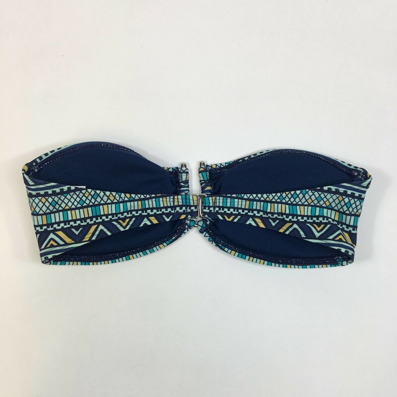 103-214 Kirra, Blue geo pattern, Size: Medium Blue strapless bikini top nylon/elastane/polyester   Nylon Spandex, lining polyester, metal hardware U hook joins cups, nice hook closure for back. Removeable soft cups. Hand wash cold, no bleach line dry Made in Cambodia.
2.65 oz