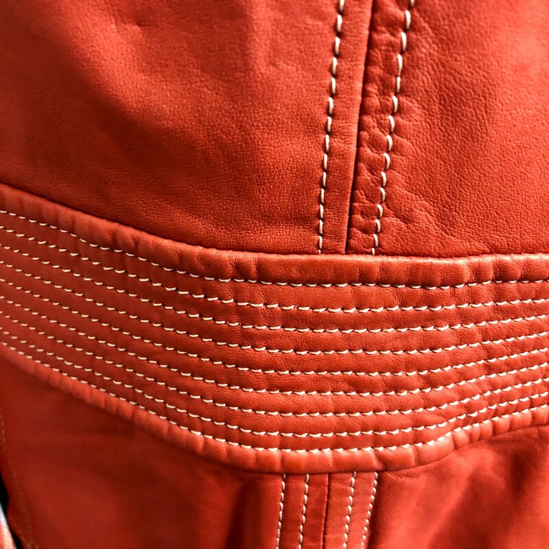 MOSCHINO \"CHEAP AND CHIC\" Muted Orange Leather Jacket - Size = USA 8, IITALY  42. Made in Italy, pointed collar, 3 button front closure, UNIQUE AMOUNT OF STITCHING throughout.  Please note all of the pictures taken to qualify this.  The striching ranges from collar, waist, shoulders as well as  sleeves and base of  jacket.  Sweet floral applique on front lapel made of leather as well.  Condition - slight wear throughout.  Approximate Measurements = bust = 34\", shoulder = 15\" across, length = 21\". Lovely addition to any dress, slax  and certainly an ever classic pencil skirt.