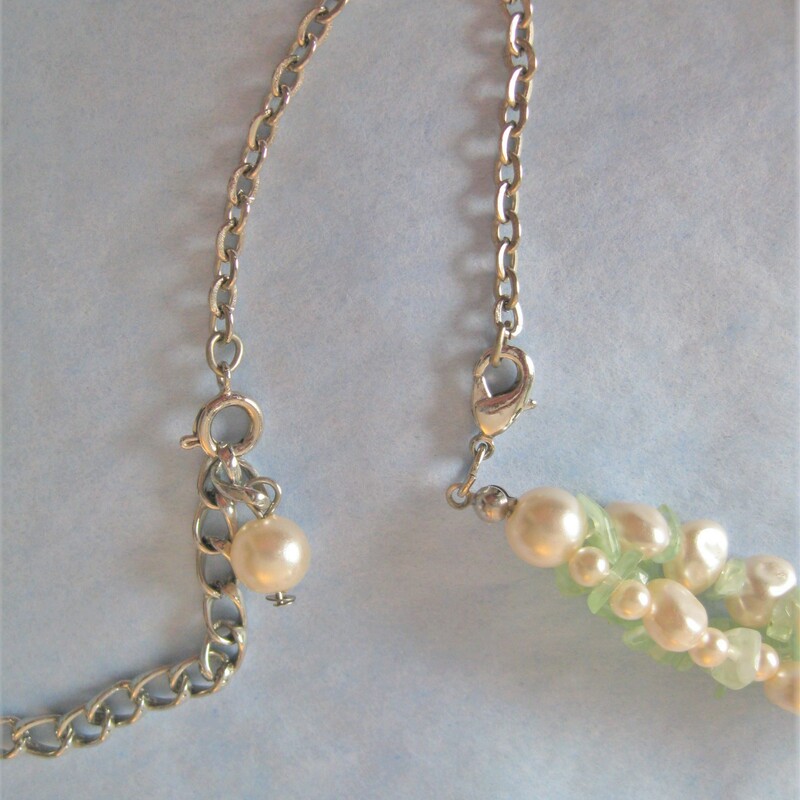 In the old days, ladies always matched their outfits carefully including their jewelry<br />
This set was not necessarily purchased together but look perfect together<br />
Multistrand necklace w green & white stone chips & matching clip earrings w faux pearls & green bits<br />
The necklace can be twisted and worn as a torsade choker. It has an extender section on the chain so you can play with the length.<br />
As shown, the necklace is 26in long.<br />
The earrings are 3/4in across.<br />
<br />
Thanks for looking!