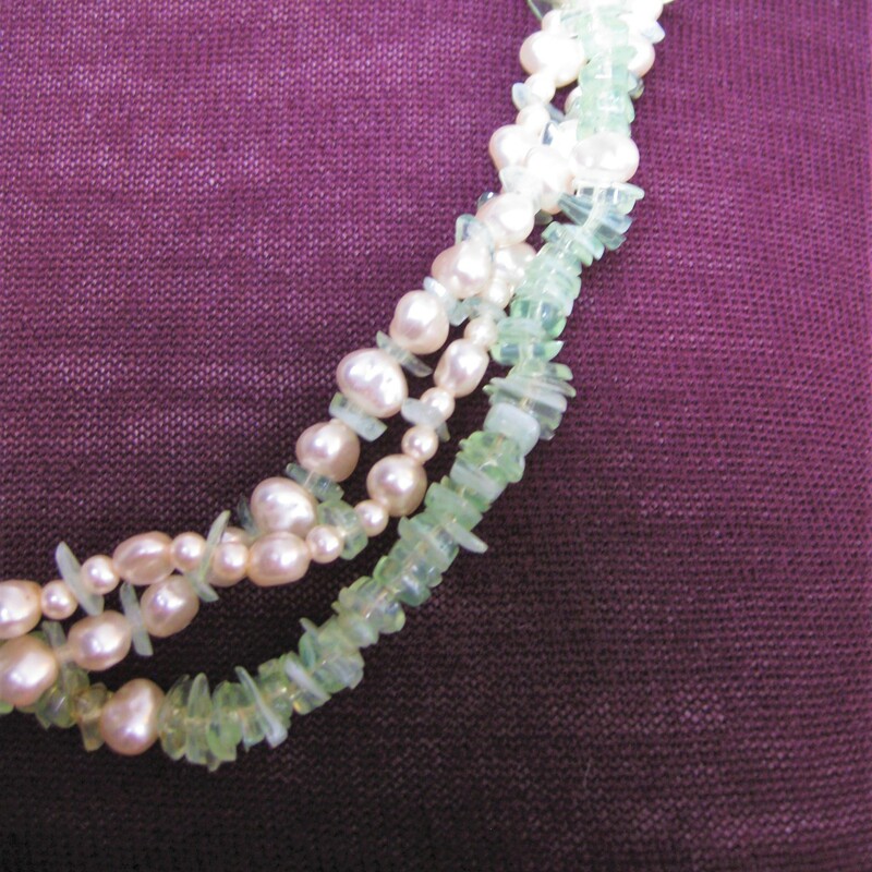 In the old days, ladies always matched their outfits carefully including their jewelry<br />
This set was not necessarily purchased together but look perfect together<br />
Multistrand necklace w green & white stone chips & matching clip earrings w faux pearls & green bits<br />
The necklace can be twisted and worn as a torsade choker. It has an extender section on the chain so you can play with the length.<br />
As shown, the necklace is 26in long.<br />
The earrings are 3/4in across.<br />
<br />
Thanks for looking!