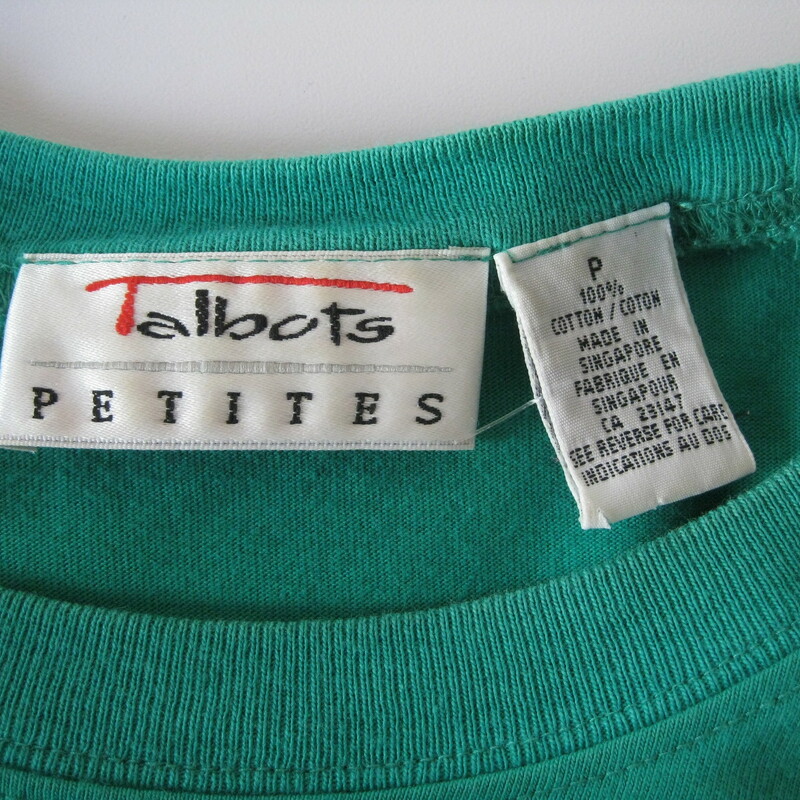 Simple blank canvas of a dress in green cotton knit from talbots<br />
Pullover styling with elasticized waist.<br />
Raglan Short Sleeves<br />
Pockets!<br />
Embossed crest on the chest<br />
Excellent condition<br />
Marked Size P<br />
100% cotton<br />
Light-weight shoulderpads<br />
Used to have a belt, but none is included.<br />
<br />
The belt photographed is not included. It is available for purchase here in my etsy - see my Belts section<br />
<br />
A-A: 16 1/4in<br />
W: Stretches from 12 3/4in to 15in or 16in<br />
H: Free<br />
L: 45in<br />
<br />
Thanks for looking!