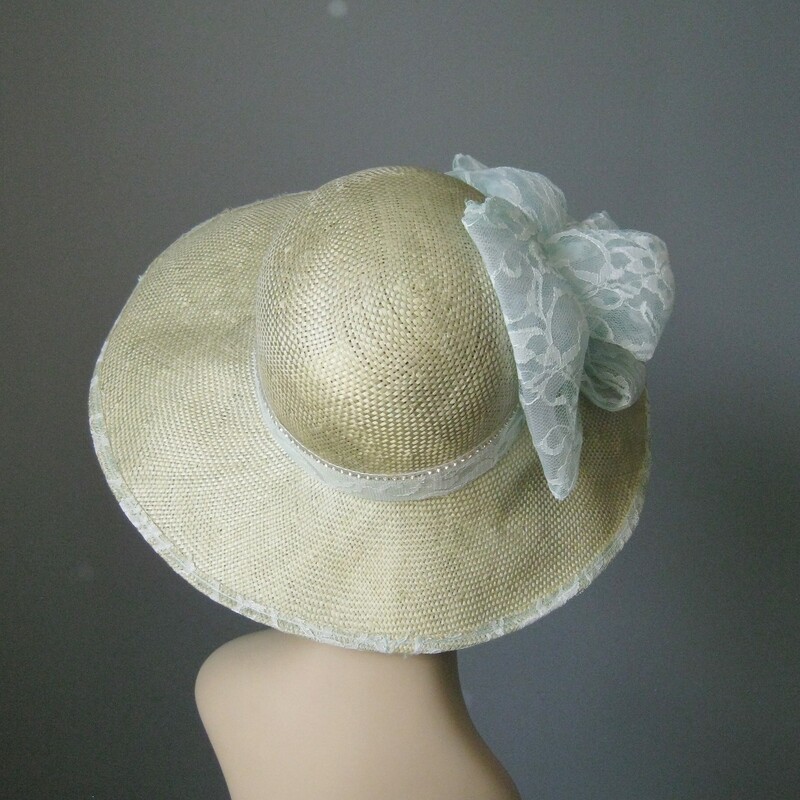 Frame your face at your next racing meet in this gorgeous high quality sunhat.
by Mysha

NWT but probably from the 80s or 90s
USA
All natural straw, synthetic lace, rhinestones
The straw is uncolored, the lace is the palest green, almost white
Cicumference: 21 1/2in
Thanks for looking!