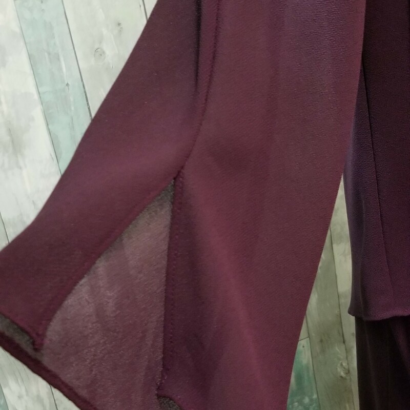 This beautiful two piece long formal would be a wonderful mother of the bride/groom dress. The sheer jacket has beading that matches the bottom of the dress. The fabric content tag has been removed but it's likely 100% polyester<br />
NO RETURNS. If you are uncertain of size, please stop in and try it on.<br />
Eggplant<br />
Size: 12