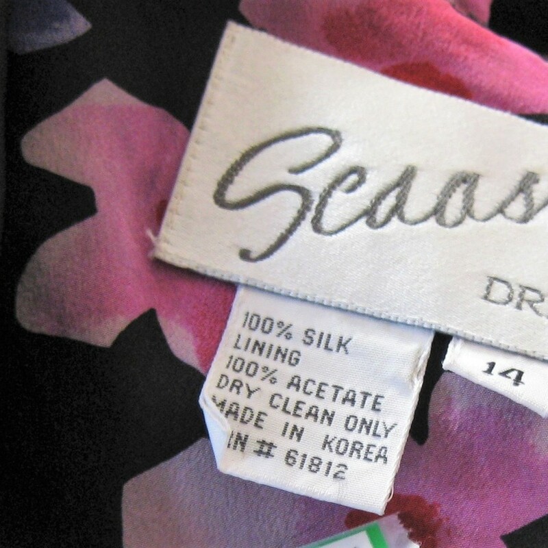 Scaasi floral silk fitted cocktail dress.<br />
Black background with multi color floral pattern<br />
The dress is shaped with ruching to the side for a very flattering silhouette<br />
Fully lined<br />
Jewel neckline<br />
Long sleeves<br />
shoulder pads<br />
Marked size 14, but it would be small for a modern size 14<br />
Flat measurements<br />
Shoulder to shoulder: 17in<br />
Armpit to Armpit: 20in<br />
Waist: 17in<br />
Hips: 20in<br />
<br />
Thank you for looking.<br />
#14219