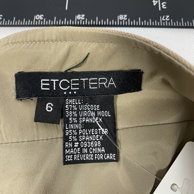 100-1014 Etcetera, Tan, Size:  6 plain beige skrt with 2 small slits in the front 57% viscose 38% virgin wool 5% spandex  good