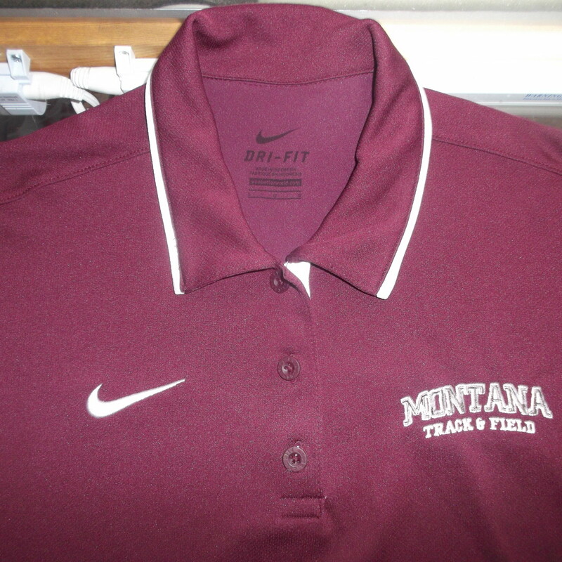 Montana Grizzlies Track & Field Women's Nike Dri Fit Polo Size Large Maroon<br />
Rating:   (see below) 3 - Good Condition<br />
Team: Montana Grizzlies<br />
Player: N/A<br />
Brand: Nike<br />
Size: Large - Women's(Measured Flat: Across chest 19\"; length 27\") measurements are from armpit to armpit and from shoulder to hem; - please check measurements. <br />
Color: Maroon<br />
Style: Short sleeve polo shirt; Embroidered logo<br />
Material:  100% Polyester<br />
Condition: - Good Condition - wrinkled; Material looks and feels good; Some snags throughout the front; Light fuzz; Signs of use; No noticeable stains, rips, or holes(See Photos)<br />
Shipping: $3.37