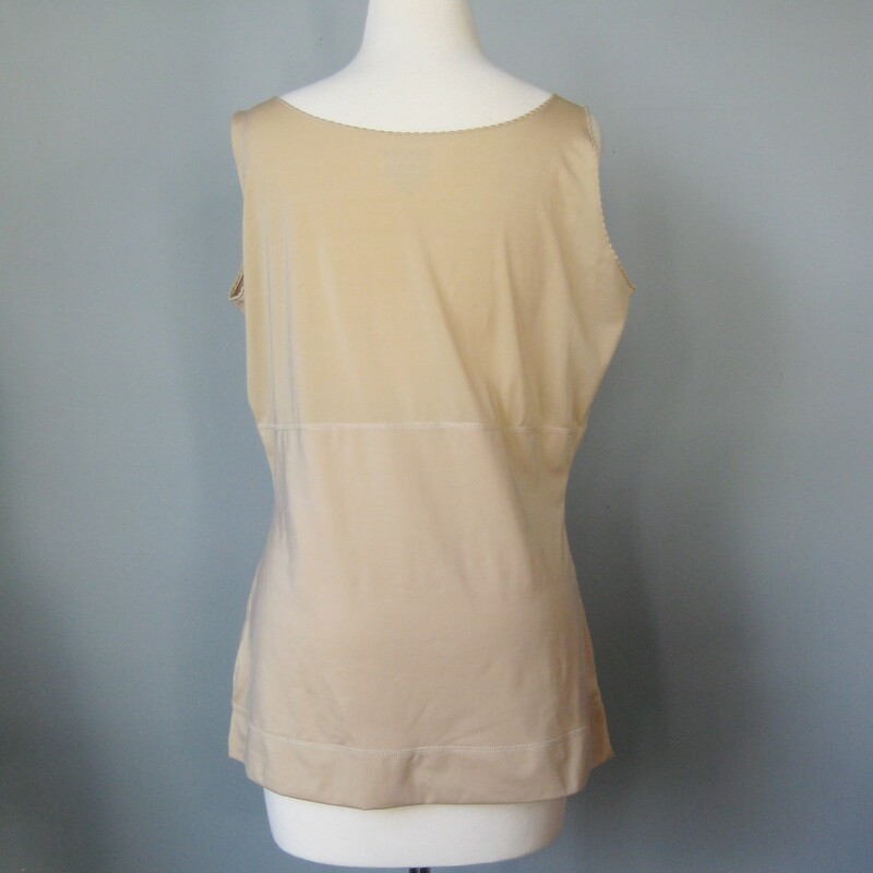 Smooth it all out with this high quality beige tank from SPANX<br />
Size 2X<br />
79% Polyester<br />
21% Spandex<br />
<br />
flat measurements (unstretched)<br />
armpit to armpit: 20in<br />
waist: 18.5in<br />
Hip: 21.5in<br />
length: 24in<br />
<br />
thanks for looking!<br />
#14230