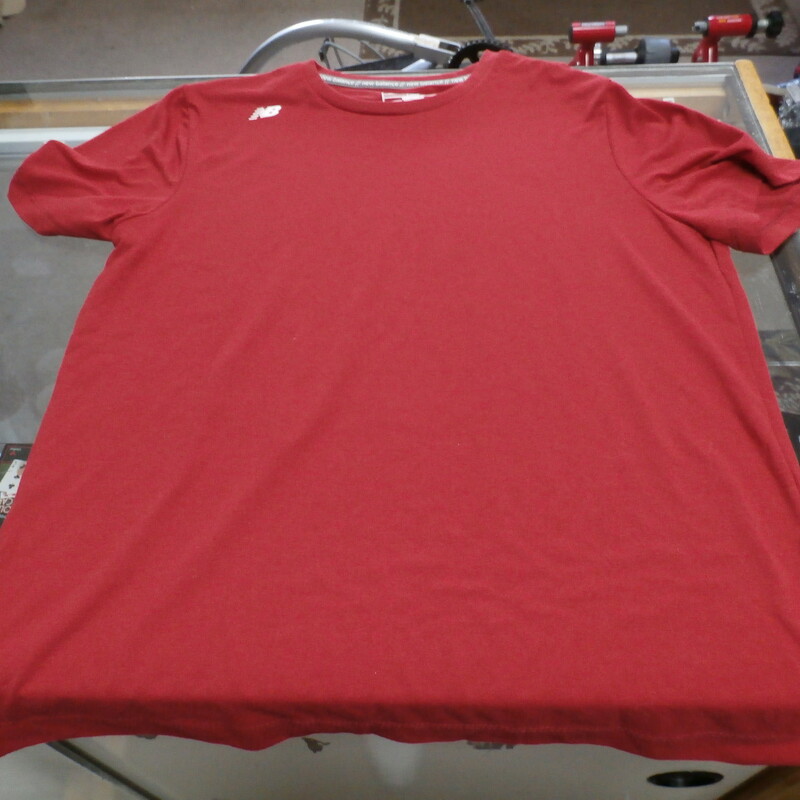 Title: New Balance men's athletic shirt red small #24750
Our Clothes Rating: 3- Good Condition
Brand: New Balance
size: men's small- (Chest: 19\" Length: 25\")
color: Red
Style: Crew Neck; athletic shirt
Condition: 3- Good- overall good condition; wrinkled; slight fading and slightly worn from use
Shipping: FREE
Item #: 24750