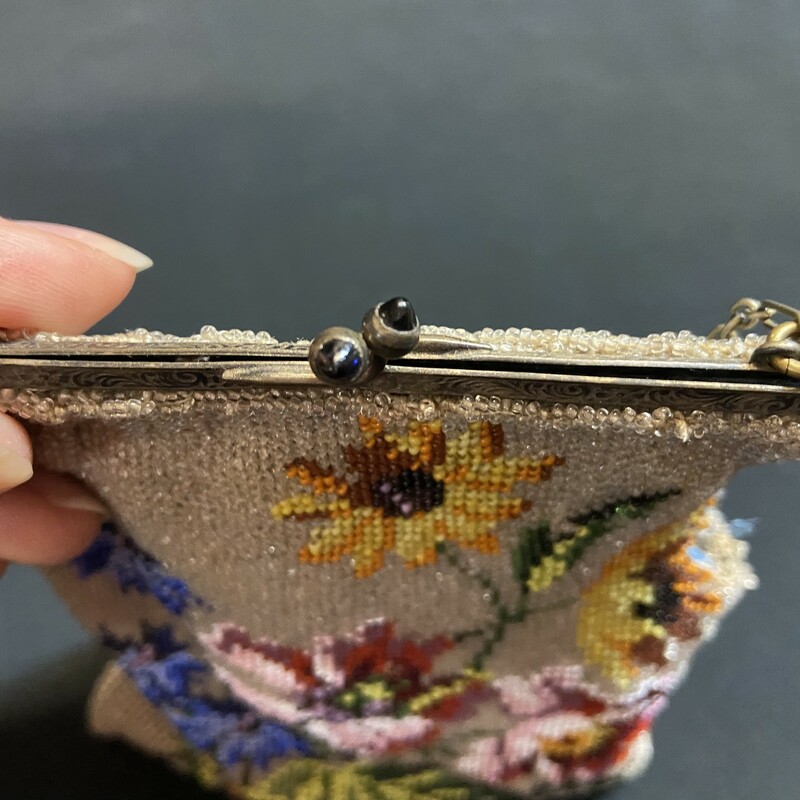 Beautiful floral beaded purse with chain handle and stones in clasp. The purse was at one time a gift; and found in the purse was a thank you letter describing it dated February 24; 1927.