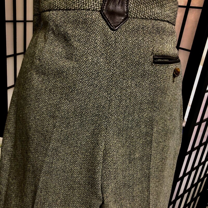 ETRO GREEN HERRINGBONE EQUESTRIAN STYLE SLAX - SIZE 42 (USA 6).  Very unique equestrian style straight leg cuffed slax.  A multitude of leather accents throughout as well as an inner 13\"  patch on each leg reflecting the style - zip and button closure, 3  uniquely  designed leather belt loops, 2 front zippered pockets with leather piping and leather Etro embossed pulls,  1 back buttoned pocket with leather piping as well.  Composition:  83% wool, 15% nylon, and 2% elastic. Approximate Measurements:  Hip = 34\", Leg = 36.5\", Inseam = 27\", Rise = 8.5\" and Waist = 30\".  Could be paired up nicely with a sharp pair of brown boots.  Please remember, designer sizes can be inconsistent  -  Please be sure of your size in designer line. Condition = Very Good.  Slight Wear. Very smart!!