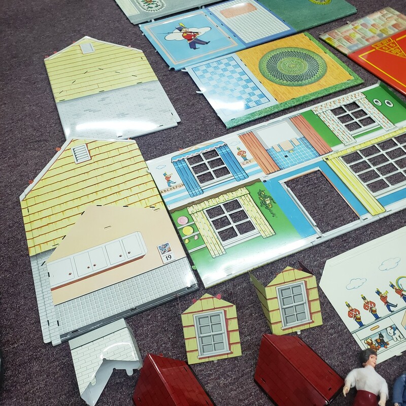 Vintage Metal Doll House, Unassembled,  W/ 4 People<br />
Excellent Condition Tin Litho, 25 pieces total w/ people