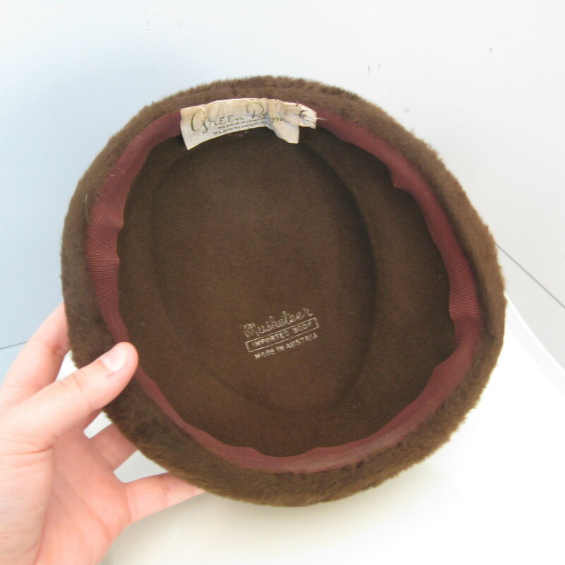 This casual ladies hat from the 1940s comes from a specialty shop within Bloomingale's that concentrated on interpreting the mode of each season for the American consumer. This little hat is made of plush fur felt, has a folded shape and a bow on the back.<br />
<br />
The inner hat band measures 20.25<br />
<br />
Please note: the blue band appearing in my photos is not part of the hat, it's part of the paint work on the mannequin.<br />
<br />
<br />
Thank you for looking!<br />
#10838
