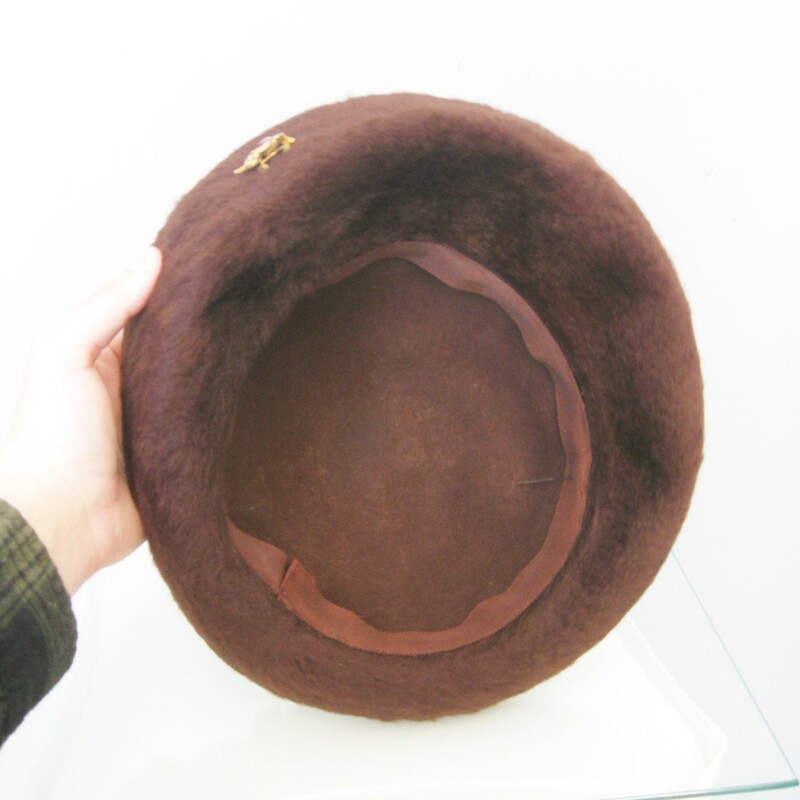 This fuzzy brown fur velour hat is so cute. It has a turned up brim and a cute little jeweled red fox pin. It also has two matching hat pins.<br />
It's made of fur velor<br />
<br />
The inner brim measures 20in which is small so measure your head and make sure this will sit on you where you want it.<br />
<br />
Thank you for looking.<br />
#10812