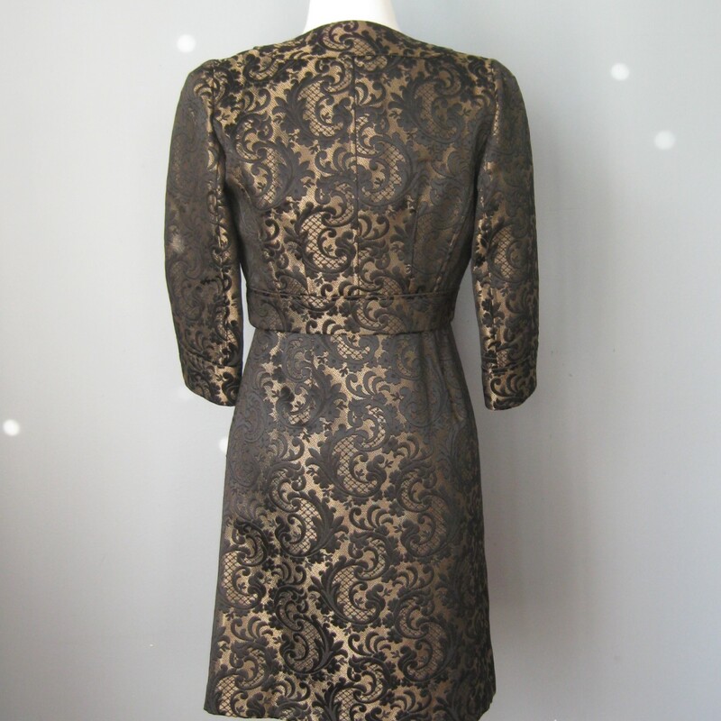 Modern power dressing for evening by Ann Taylor<br />
Substantial black & pale gold brocade<br />
Bolero Jacket w matching strapless sheath<br />
Dress comes w shoulder straps that you can easily add if desired<br />
Fully lined<br />
Side zipper<br />
Jacket has no closures<br />
Bodice has a comfortable waist stay that will keep the whole dress securely in place<br />
Size 2p<br />
My mannequin is about a size 4 so I couldn't zip the dress all the way which is why it's not sitting exactly right in some of the pictures Flat measurements: Dress: armpit to armpit: 16in waist: 13 3/4in hip: 18in length from center of neckline to hem: 28 1/4in Jacket: armpit to armpit: 19in length: 13 3/4in perfect condition! thanks for looking! #6711