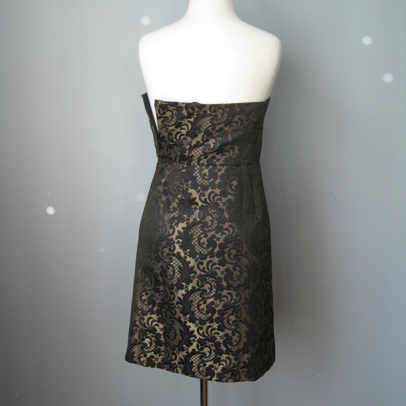 Modern power dressing for evening by Ann Taylor<br />
Substantial black & pale gold brocade<br />
Bolero Jacket w matching strapless sheath<br />
Dress comes w shoulder straps that you can easily add if desired<br />
Fully lined<br />
Side zipper<br />
Jacket has no closures<br />
Bodice has a comfortable waist stay that will keep the whole dress securely in place<br />
Size 2p<br />
My mannequin is about a size 4 so I couldn't zip the dress all the way which is why it's not sitting exactly right in some of the pictures Flat measurements: Dress: armpit to armpit: 16in waist: 13 3/4in hip: 18in length from center of neckline to hem: 28 1/4in Jacket: armpit to armpit: 19in length: 13 3/4in perfect condition! thanks for looking! #6711
