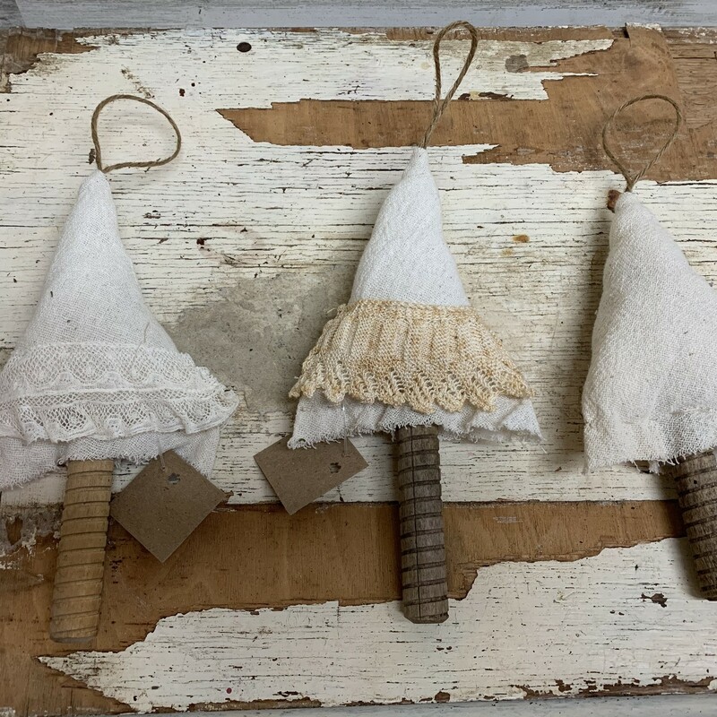 Beautiful handmade Christmas tree ornament. Made from spindle and fabric filled with cotton. Base color is the same white off, some are plain and some have a lace or crochet skirts. Please make sure to look at all the pictures for a closer visual.

Please note that the item is vintage and you will experience fabulous vintage wear.

Please let us know if you would like to have tree with skirt or plain, otherwise you will receive random ornament.

Perfect for rustic country and cottage core lovers.
Measures approx 9'' tall 4 1/2'' long 1''  wide.
Thank you.